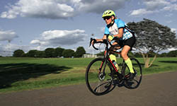 Nan Robinson rides her bike on a sunny day